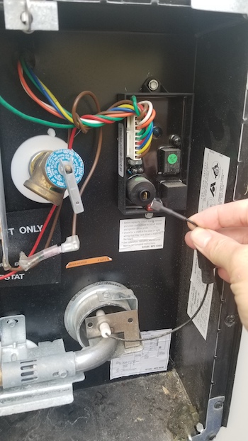 Checking the spark igniter lead from the circuit board to the electrode on the Attwood RV water heater