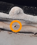 Image of pin hole in RV roof caulk