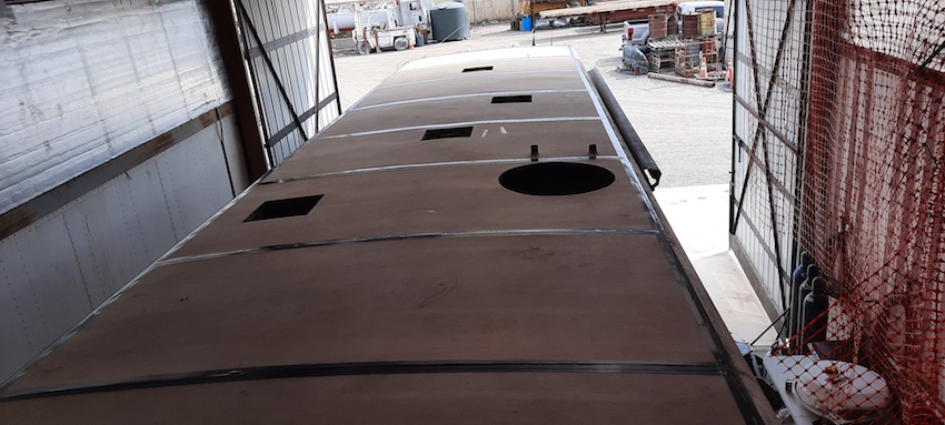 Image of new plywood fully laid and ready for the membrane layer to this RV roof.